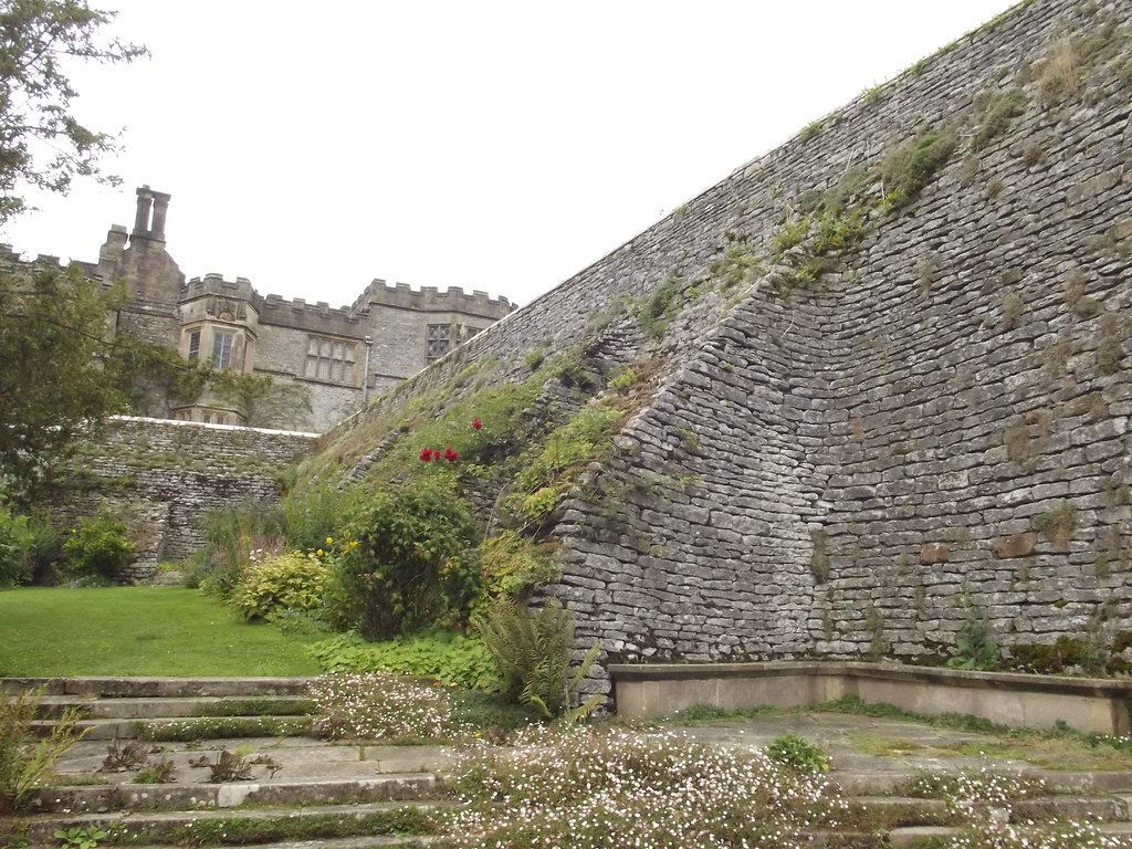 A coursed stone retaining wall